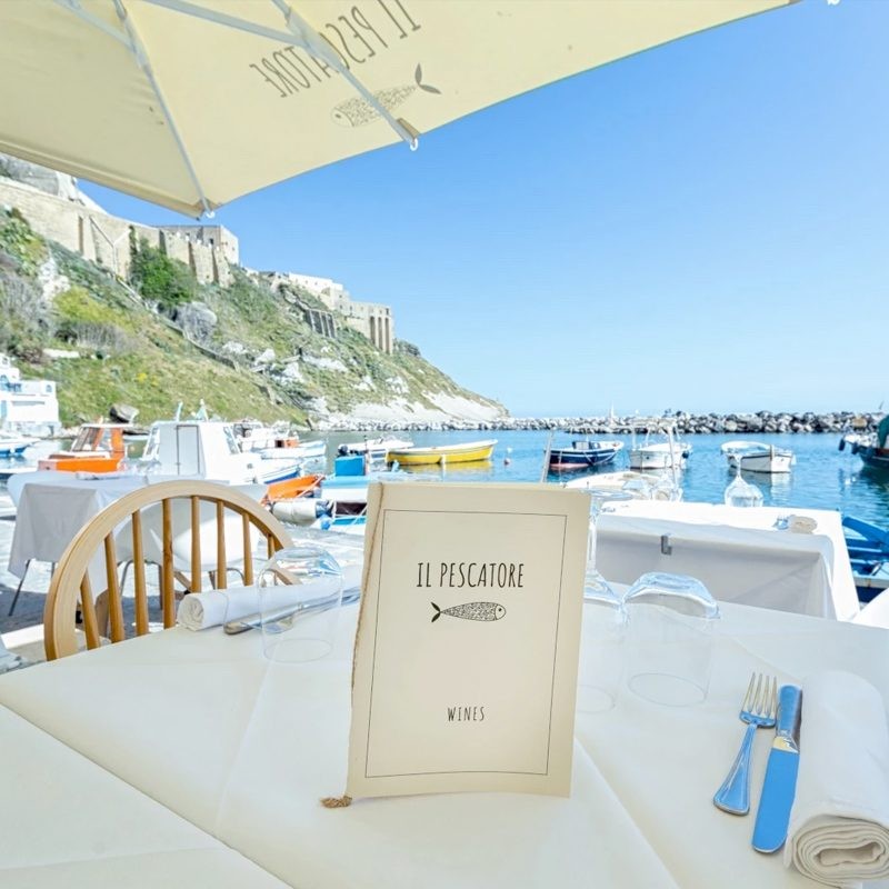 Table set at a seafront restaurant on the Amalfi Coast
